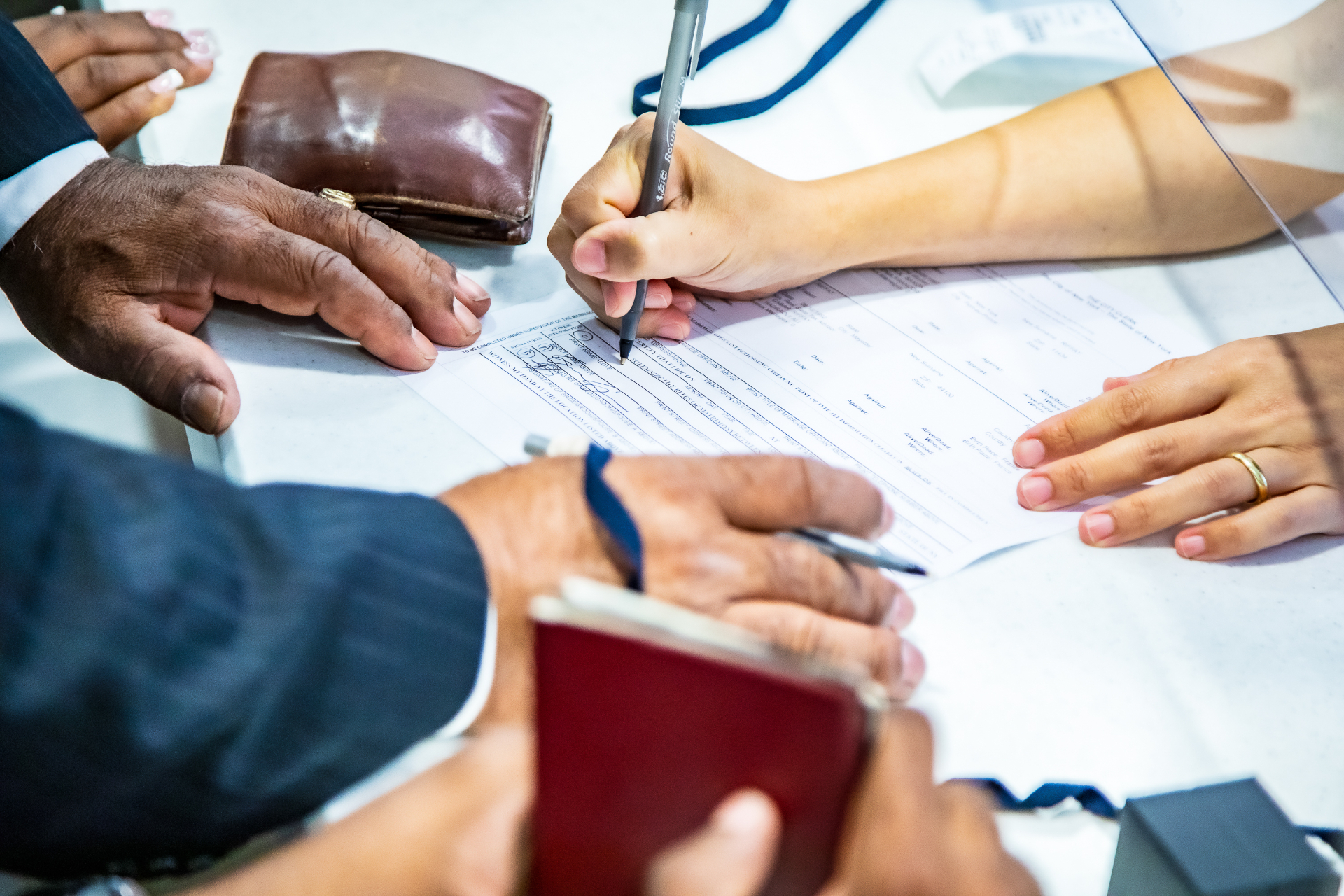 Couple signing marriage documents